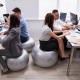 workplace wellness - employees sitting on exercise balls at their desks.